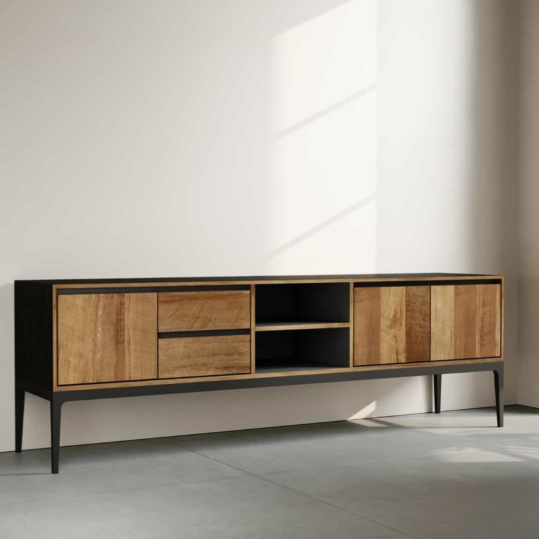 68 KOLT 2 SHELF TV STAND - 2 The Kolt 68" 2 Shelf TV Stand, a modern wooden sideboard with a black frame featuring four closed compartments and two open shelves, is placed against a white wall. Sunlight casts shadows on the wall and floor.