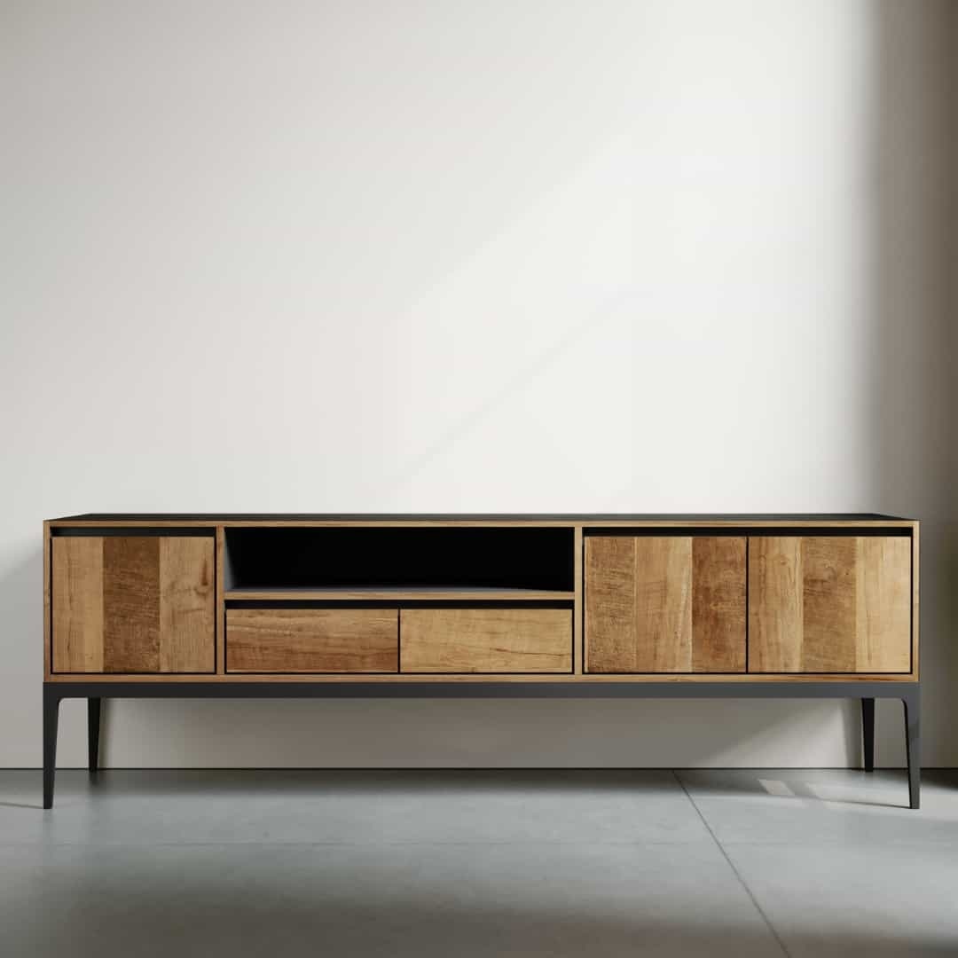 The Kolt 60" Wide TV Stand, a long wooden cabinet with a sleek black top, features two shelves in the middle and four closed compartments on either side, standing against a plain wall.