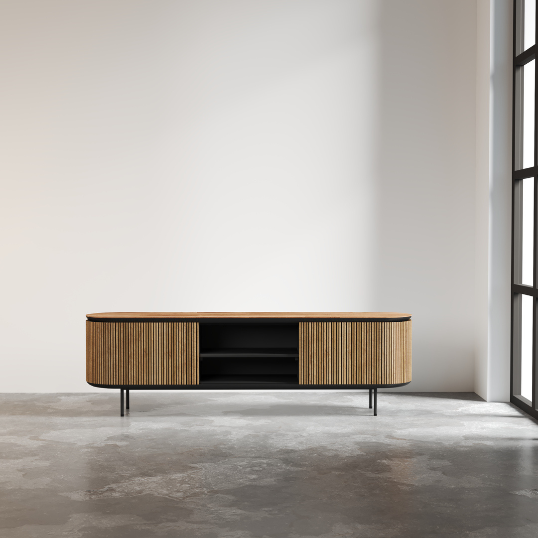 A contemporary Bolivar 2 Shelf TV Stand with sliding doors stands on a concrete floor in a minimalist room with a large window.