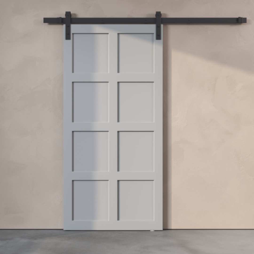 A light grey 8-panel barn door mounted on a black sliding track against a beige wall.