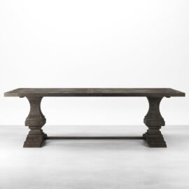 The Castello Dining Table - Café Noire is a rectangular wooden dining table with a dark finish, featuring two pedestal legs connected by a horizontal support beam. The table is set on a plain, white background.