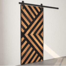 The Enigma Reclaimed Wood Barn Door Espresso, featuring a geometric pattern of diagonal black and wood stripes, is mounted on a white wall.