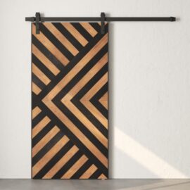 The Enigma Reclaimed Wood Barn Door Espresso features a geometric pattern of black and natural wood stripes, mounted on a sleek black metal rail against a plain white wall.