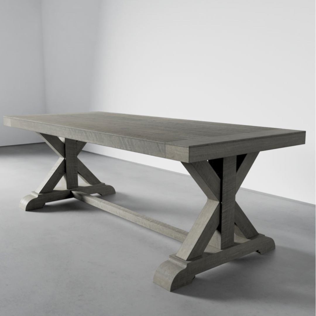 A sturdy, rectangular Madera Dining Table - Rustic Grey with an X-trestle base, placed in an empty room with light grey walls and a smooth floor.