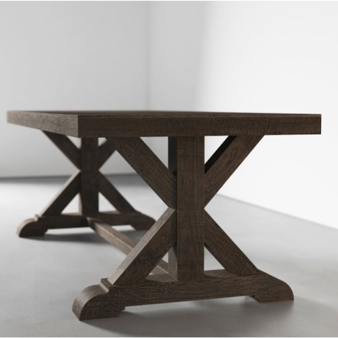 The Madera Dining Table - Café Noire, with its thick tabletop and two sturdy X-shaped leg supports, stands in a minimalist, light-colored room.