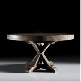 The Madera Round Table, with its intricately designed cross base, sits elegantly against a dark Café Noire background.