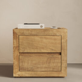 The Lugano Nightstand with two drawers, holding a closed book, a smartphone, and a pair of keys on its surface.