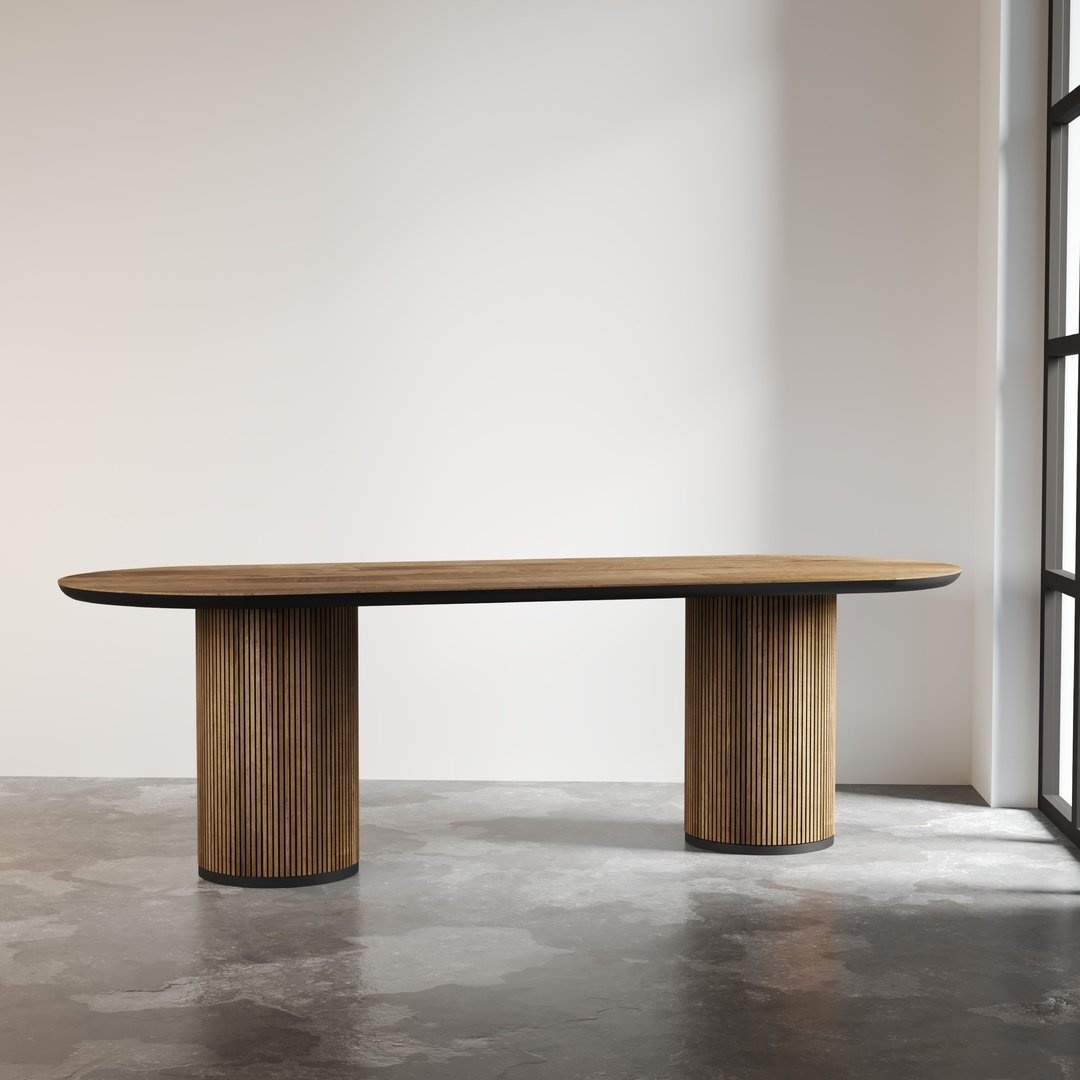 The Bolivar Oval Dining Table is a modern wooden dining table featuring a sleek oval top and two cylindrical, fluted pedestal bases, perfectly set against a minimalist background.