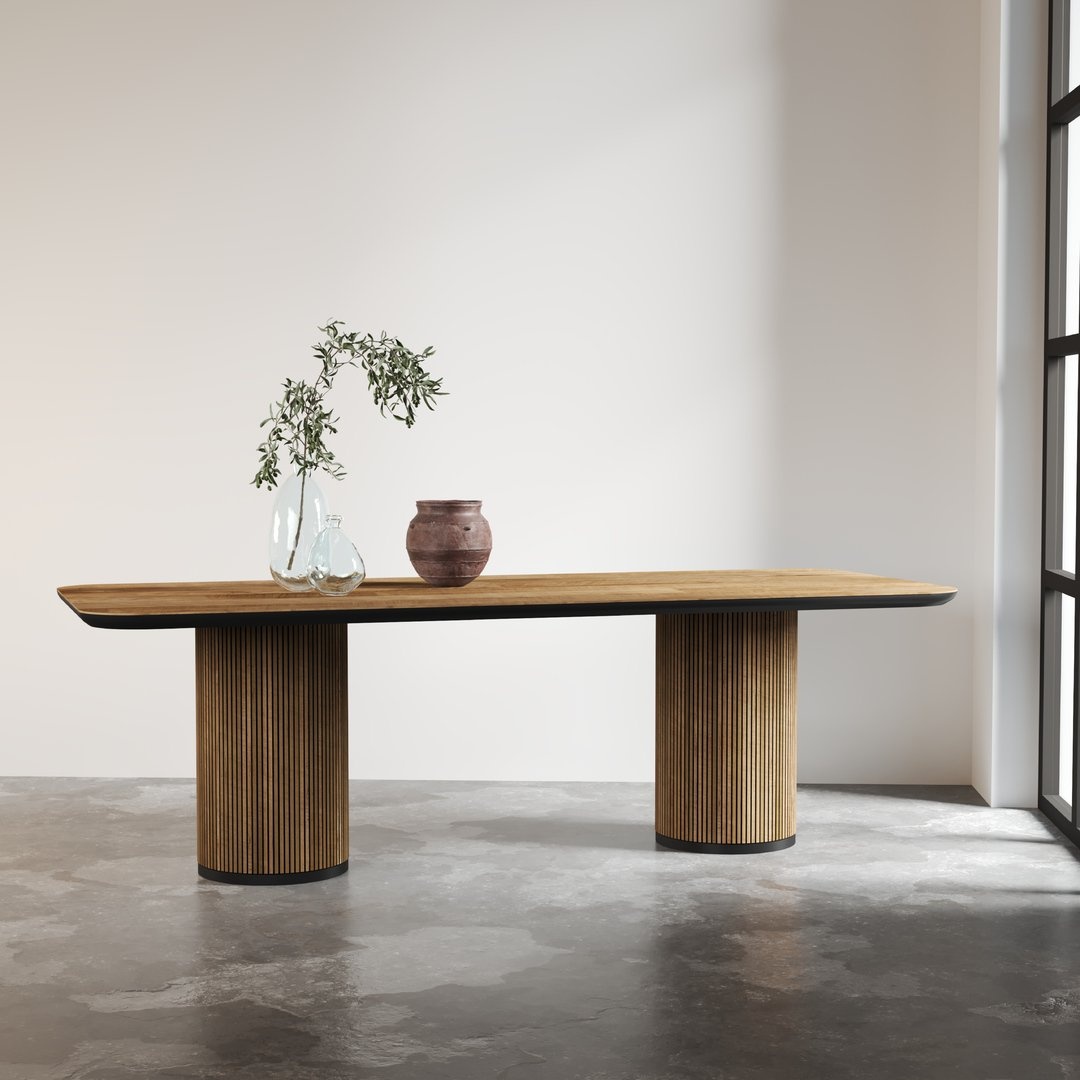 The Bolivar Dining Table stands gracefully with its minimalist design featuring two cylindrical legs, adorned with a small plant and a ceramic vase. It is set on a polished concrete floor in a well-lit room.
