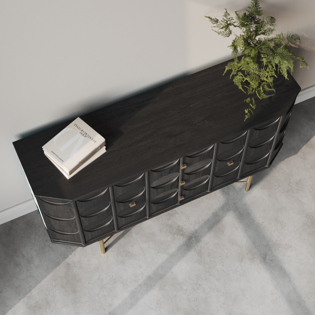 Alba 60 Side Cabinet-c An Alba 60" Side Cabinet, crafted from dark wood and adorned with brass knobs, is placed against a wall. A potted fern and a closed book rest elegantly on top of the sideboard, while the floor is concrete.