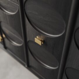 Close-up of the Alba 60" Side Cabinet, a dark wooden cabinet adorned with an oval pattern design and featuring a gold rectangular handle. This elegant piece stands at 60 inches tall, blending style and functionality seamlessly.