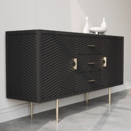 The Arista 60" Side Cabinet (Black) features modern textured doors, gold handles, and gold legs. It is placed against a light-colored wall with two decorative white vases on top.