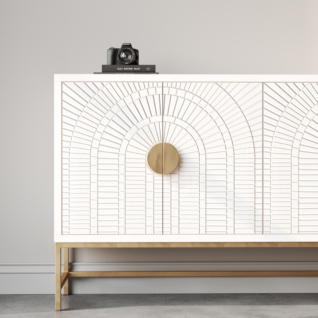 Coral 60 Side Cabinet -b A 60-inch white side cabinet named the Coral 60" Side Cabinet, featuring an intricate geometric pattern, gold handles and legs, with a book titled "EAT DRINK NAP," and a camera on top, against a light grey wall. Just imagine how lovely this piece would look with accents of coral in the decor.