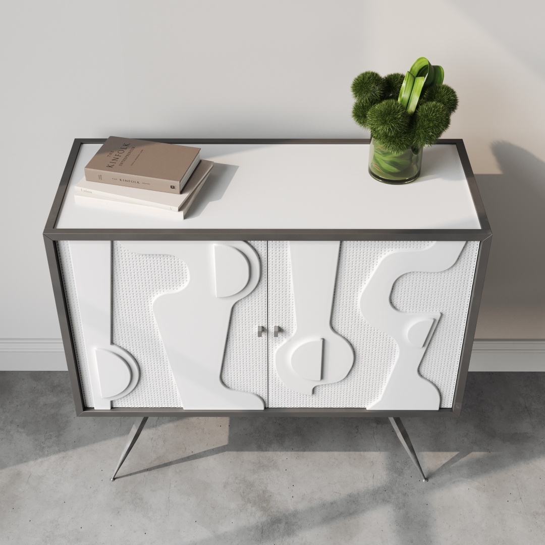 Estrella 60 Cabinet-c A modern side table featuring a white patterned front, two books, and a green plant in a clear vase placed on top of it. Reminiscent of the Estrella 60" Cabinet's sleek design, this table stands on angled metal legs.