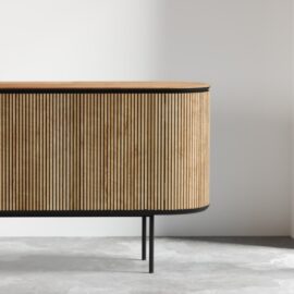 The Bolivar Dining Buffet features vertical slats, black edging, and black metal legs, set against a plain white wall.