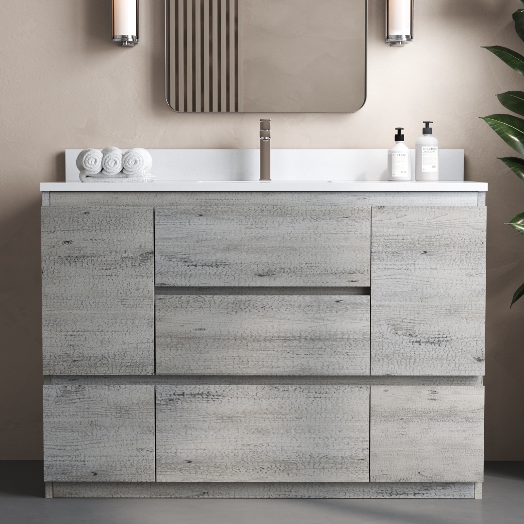 The contemporary Vamo 48" Single Sink Bathroom Vanity is complemented by a mirror above and boasts a light gray, wood-textured cabinet, a pristine white countertop, an integrated sink, and neatly arranged toiletries like towels and soap dispensers.