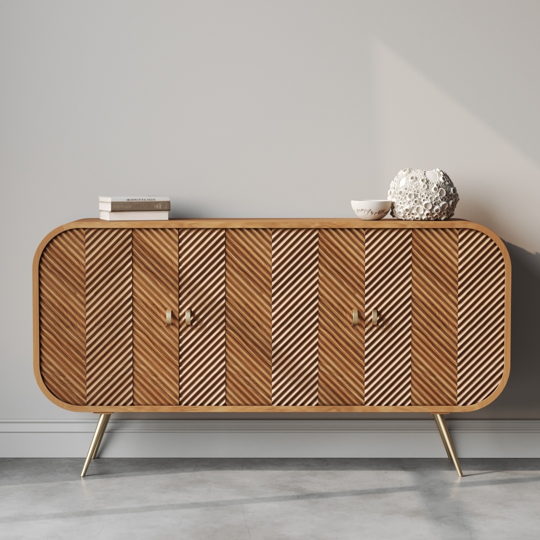 The "Vista 60" Side Cabinet" showcases a striking chevron pattern and stands on gleaming gold legs, with two books and a round decorative object carefully placed on top.