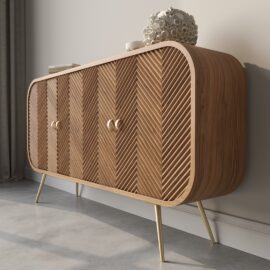 The Vista 60" Side Cabinet, featuring a herringbone pattern and gold handles, stands against a light-colored wall. An intricate, white decorative object rests on its surface, completing the elegant vista of the room.