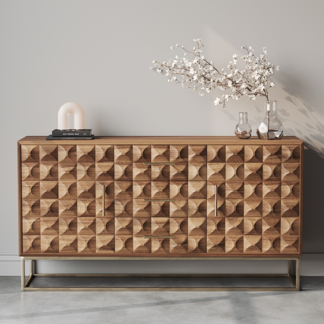 The Wadi 57" Side Cabinet, featuring modern wooden construction with geometric patterns, displays a decorative branch in a vase, two glass bottles, and a small lamp against a gray background.
