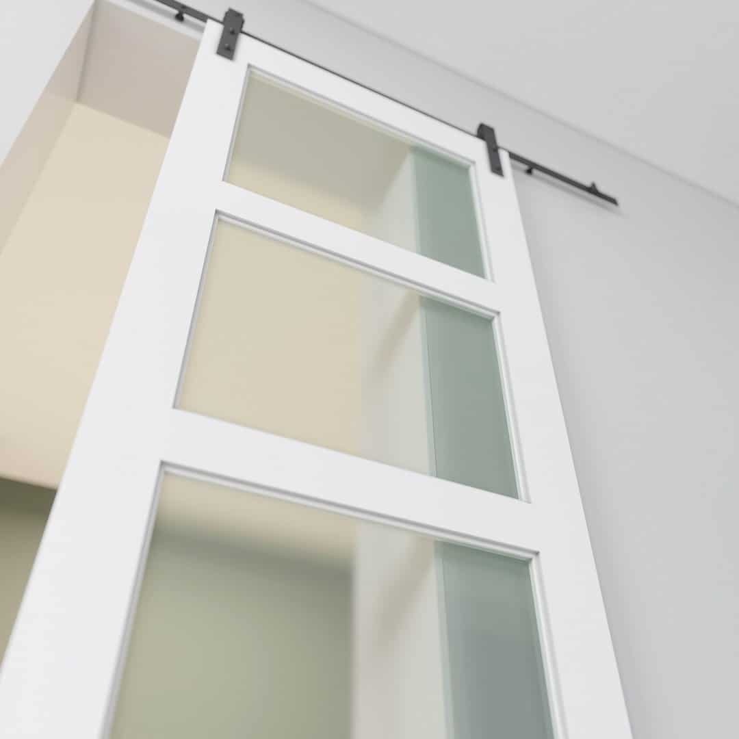 3-Panel-Glass-White-3.jpg A 3-Panel Frosted Glass Barn Door installed on a black track.