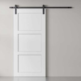 The 3-Panel Barn Door, finished in white, is mounted on a black sliding track and positioned against a light gray wall.