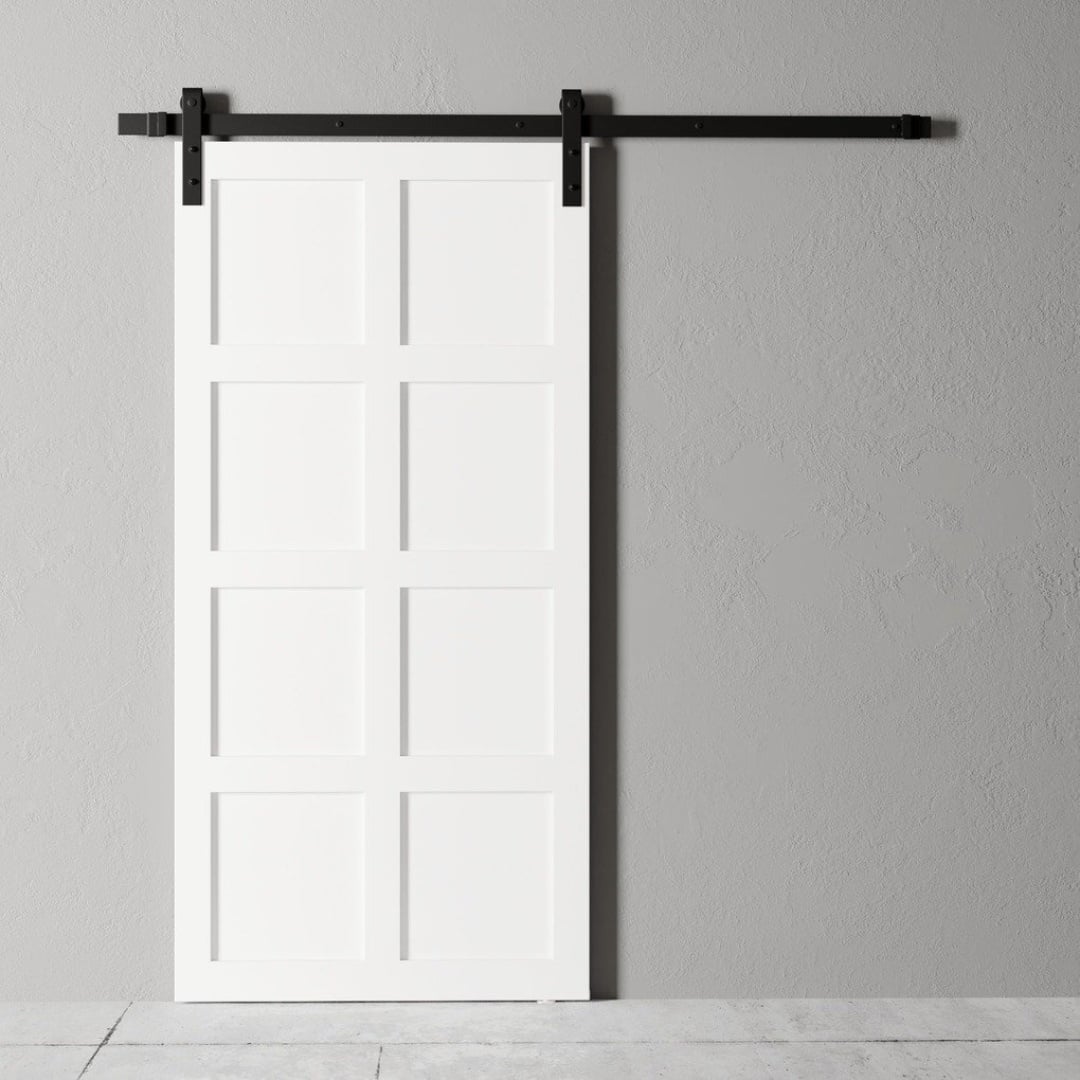 An 8-Panel Barn Door in white with a black metal track, installed on a light gray wall.