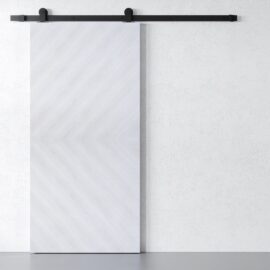 The Bianco Barn Door glides along a black metal track, contrasting beautifully against the light textured wall.