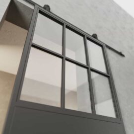 A French Casement 7-Panel Barn Door with a black frame and glass panels, mounted on a gray wall.