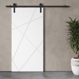 A Klaus Geometric Barn Door, featuring modern white sliding panels with geometric line patterns, hangs on a wall near a potted plant.