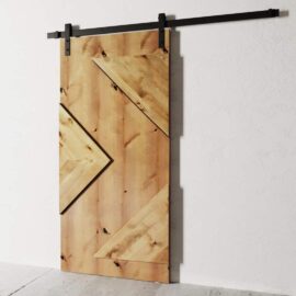 A Raised Arrow Head Barn Door with diagonal panel designs, mounted on a black metal rail, installed on a white wall.